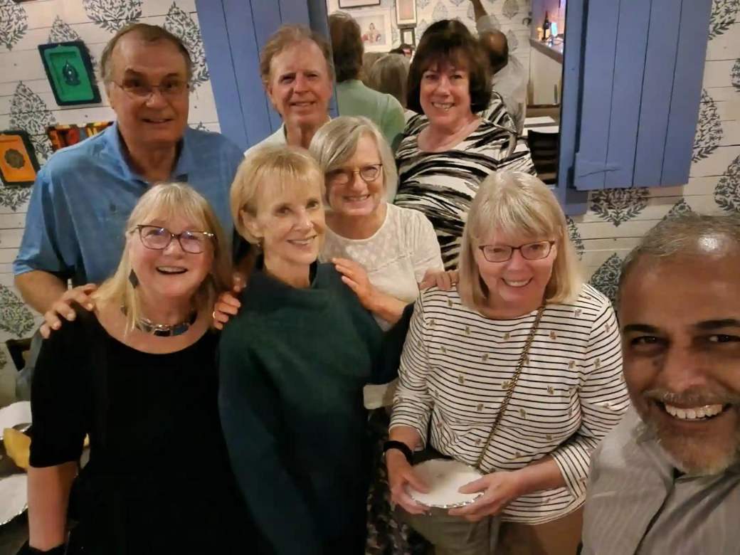 A party of six regulars gathered together for a photo with Sonny after dinner